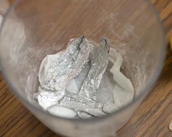 Another common household component used for making meth is aluminum foil. Here, authorities display more meth lab items.