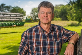 Mark Crawford stands at his farm near Danville, Ill. Crawford, who grows corn, soybeans and wheat on his large farm, said the crop insurance programs are important parts of the risk-management safety net for farmers.
