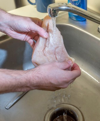 Many consumers still wash chicken before cooking it, but doing so splatters pathogens throughout the kitchen. Instead, consumers should simply "start letting heat do the job," according to food-safety expert Catherine Cutter.